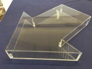 Arrow shaped display case with removable back